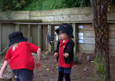 Vision and values gallery, children playing together by trees